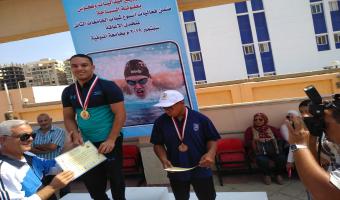 الطالب أحمد شعبان راتب يحصد (ذهبية وفضية) في مسابقات السباحة ضمن فاعليات أسبوع شباب الجامعات المصرية لمتحدي الإعاقة